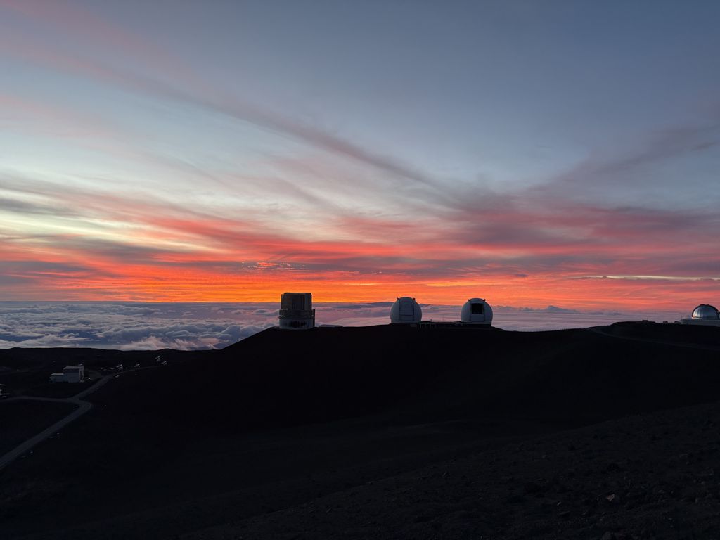 The sunset on Mauna Kea, behind the observatory.