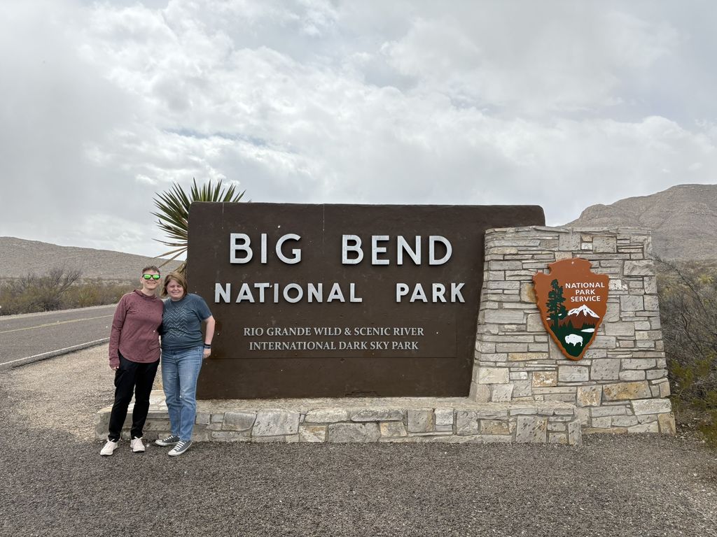 Caitlin and Scout in front of the Big Bend National Park sign
