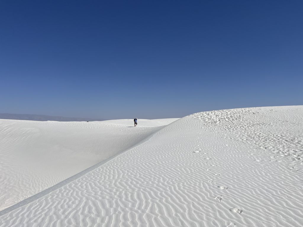 Me walking along the edge of a dune.
