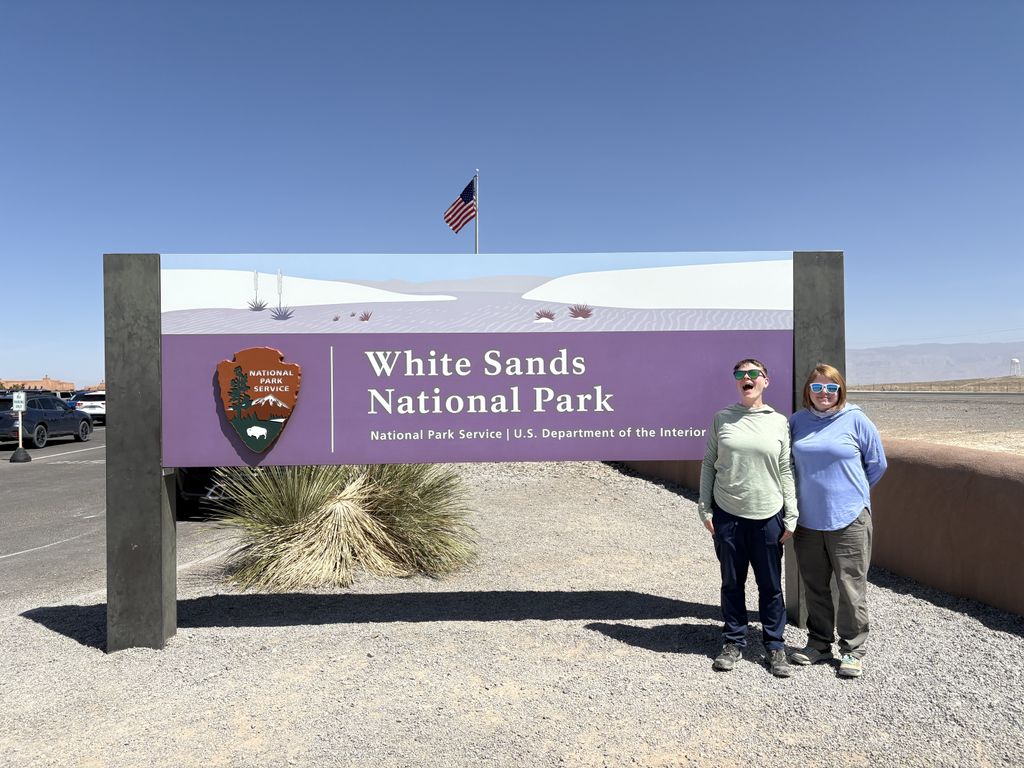 Us at the White Sands National Park sign.